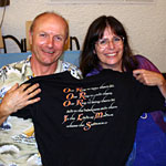 Hammond Peek and Osanna Vaughn show off an official crew t-short from The Lord of the Rings.